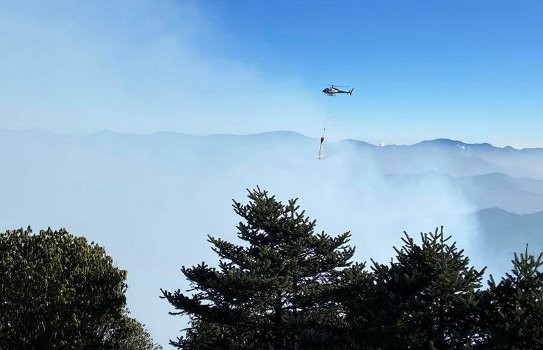 Helicopter used to douse fire near Pathivara Temple