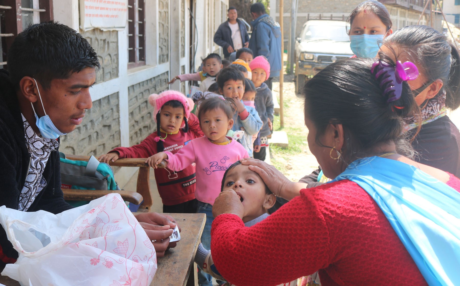 Vitamin 'A' being administered to children